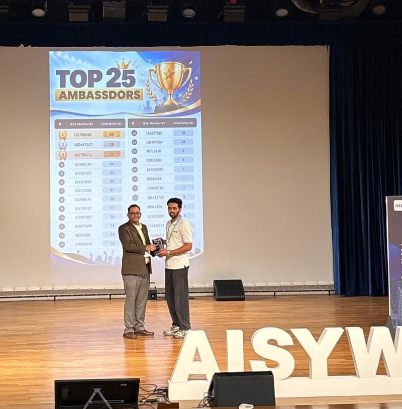 Prathamesh Palve receiving the Top Ambassador award on stage at IEEE AISYWLC 2026